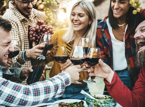 happy-friends-drinking-red-wine-at-farm-house-vine-2023-10-04-21-51-21-utc.jpg